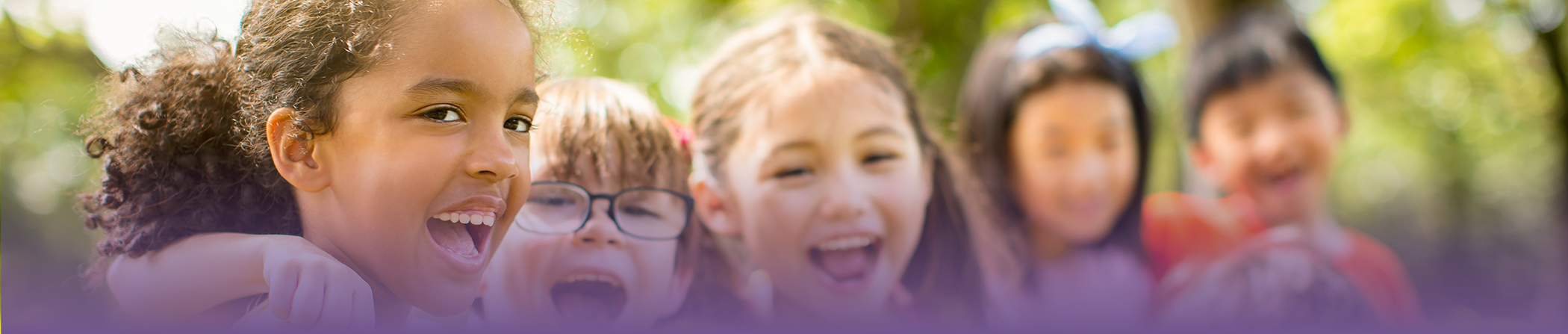 Group of kids laughing together outdoors