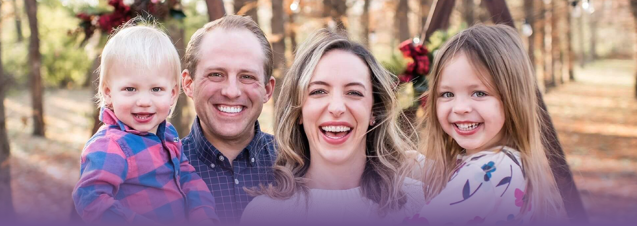 Keokuk dentist Doctor Steven Sokolik smiling with his wife and two children